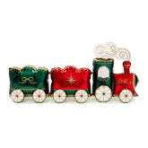 A Christmas-themed train-shaped decorative container or candle holder, featuring three carriages in green, red, and green with gold accents, white wheels, and a white smoke graphic on a plain white background.