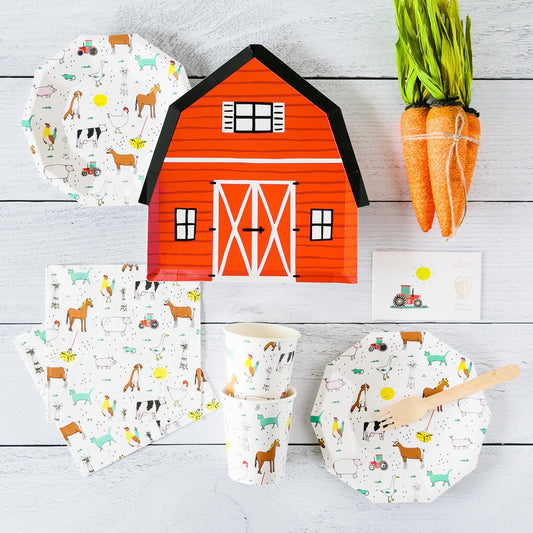Farm themed party supplies set with barn-shaped plate, animal print plates, cups, napkins, carrots decor